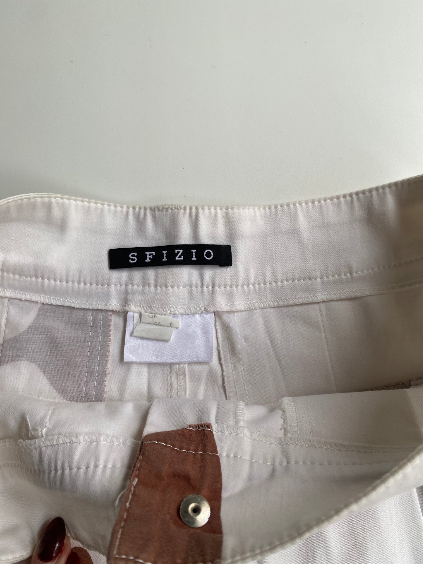 White pleated mini skirt