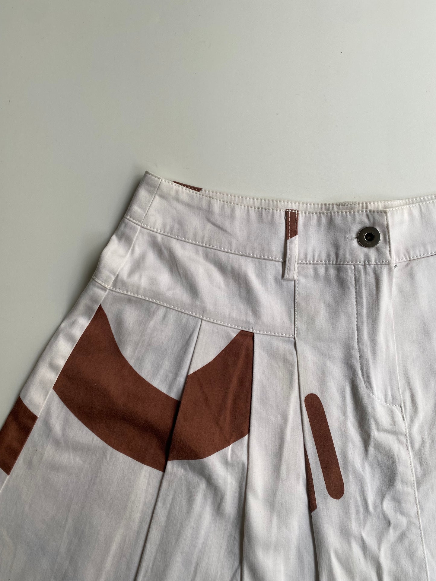 White pleated mini skirt