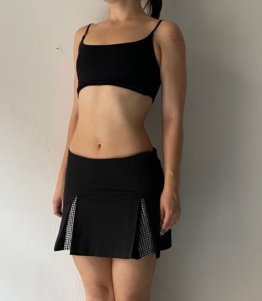 Black pleated mini skirt with plaid details